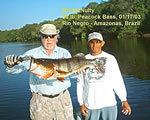 Ric McNulty holding a Peacock Bass